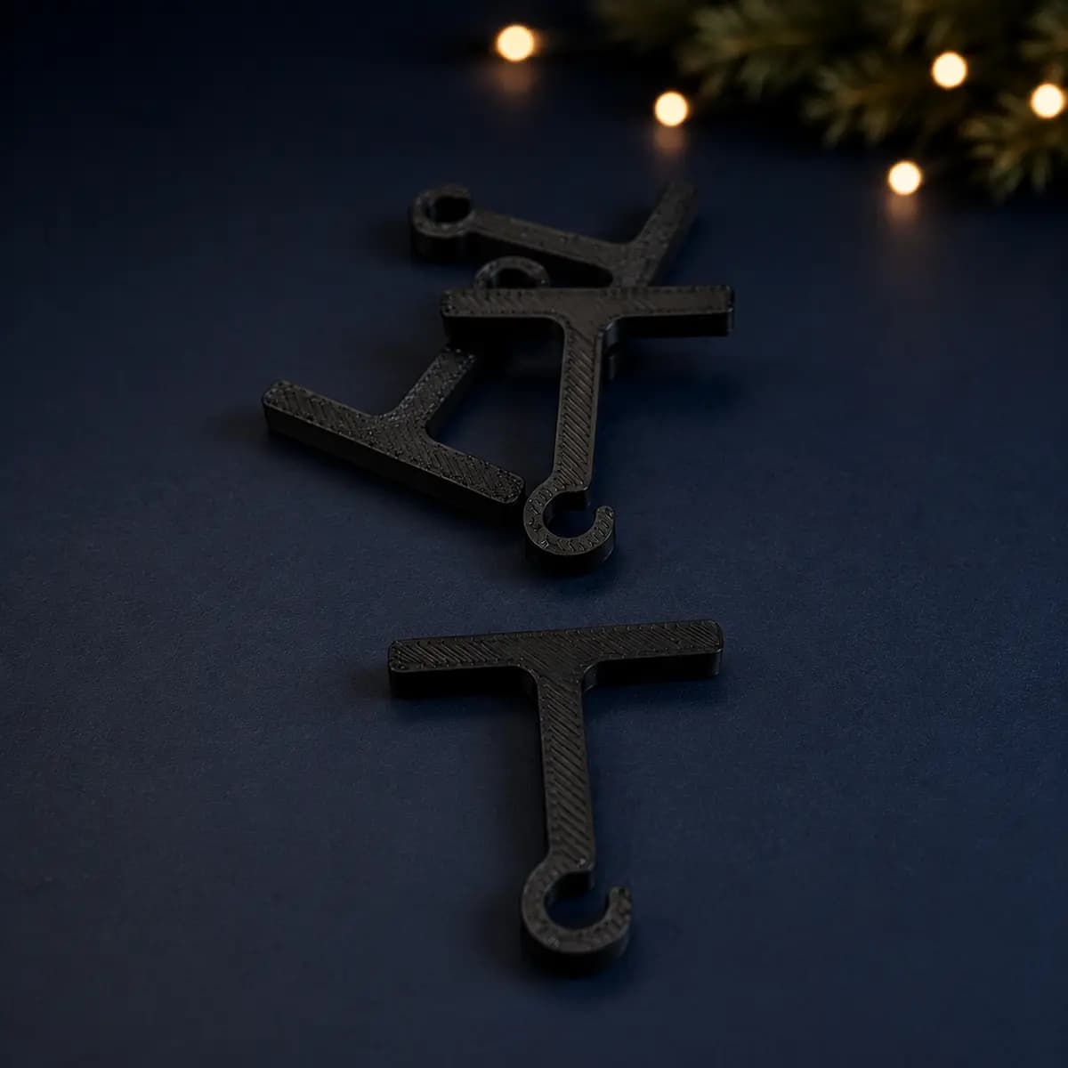 Black 3D-printed Christmas light hanger for eaves in size Large
